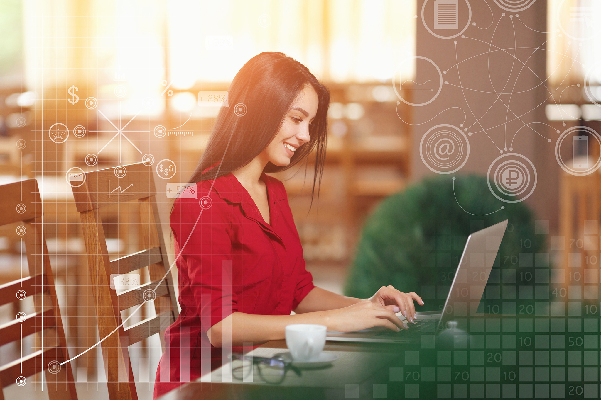 Young business woman uses laptop in cafe